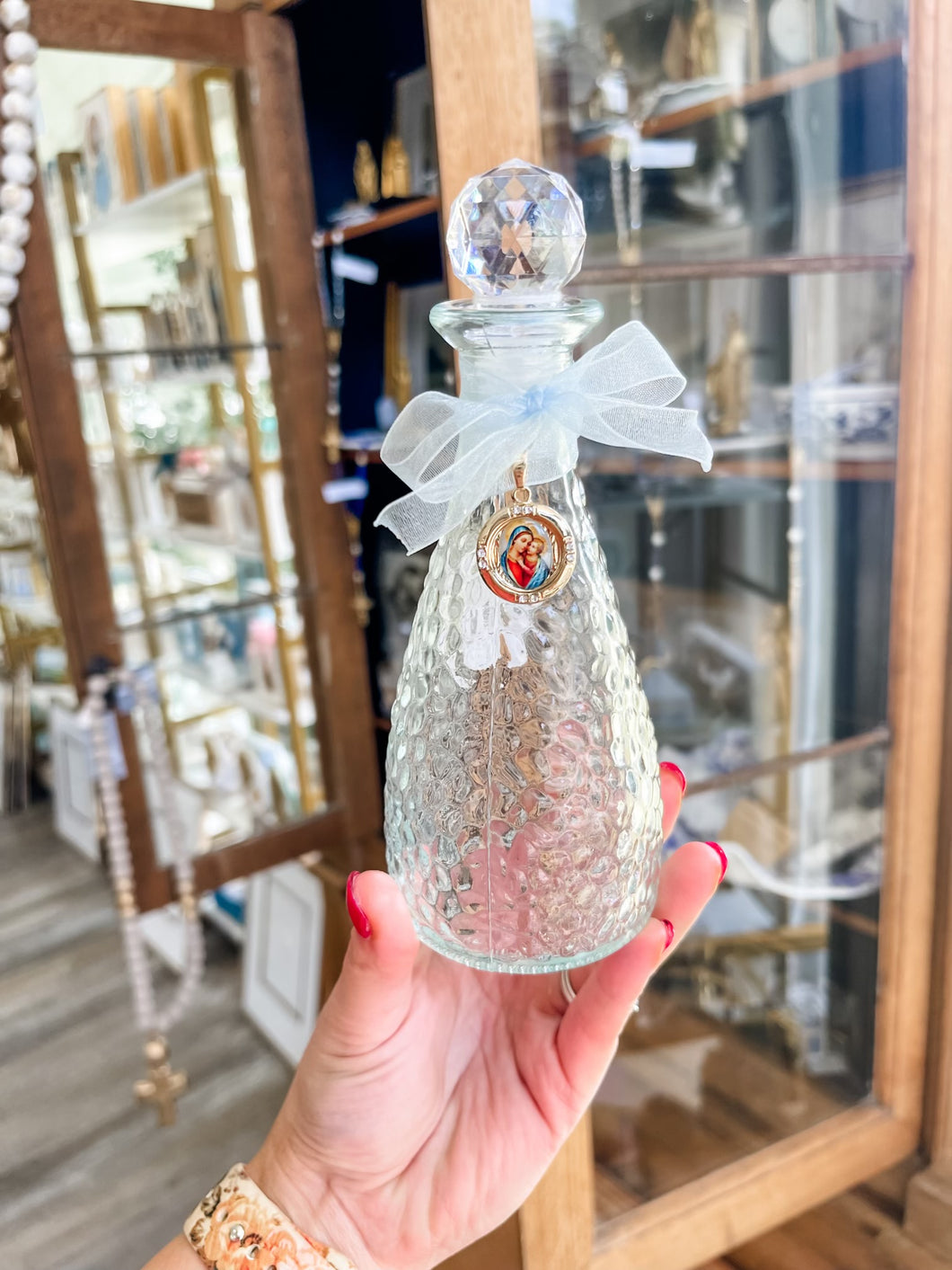 Round Mary and Child Bottle with Light Blue Ribbon- The Gilded Mosquito by Lisa Leger