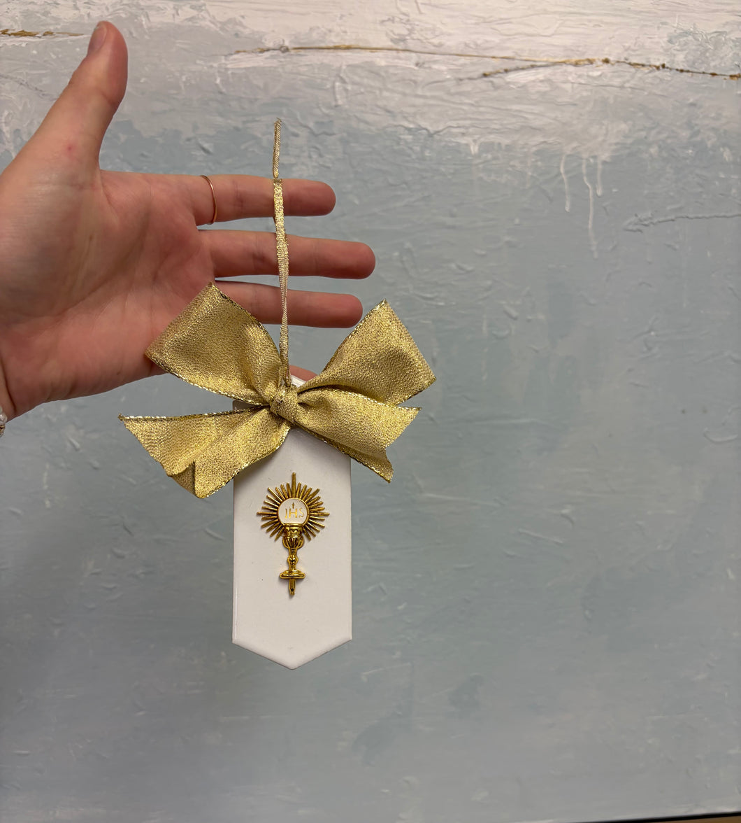 Eucharist on white back with gold ribbon ornament - Grace and Mercy Co