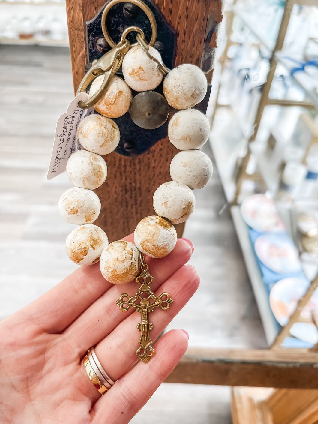 White with gold rustic wood bead wristlet keychain with larger crucifix-Stretched Out Designs By Chelse Breaux