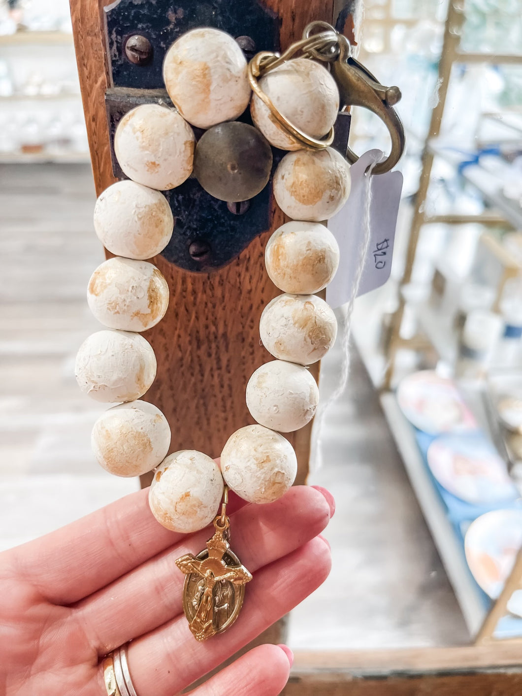 White with gold rustic wood bead wristlet keychain with crucifix and the holy family-Stretched Out Designs By Chelse Breaux