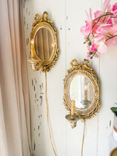 Load image into Gallery viewer, Round mirrored very old antique wall sconces with gold bow
