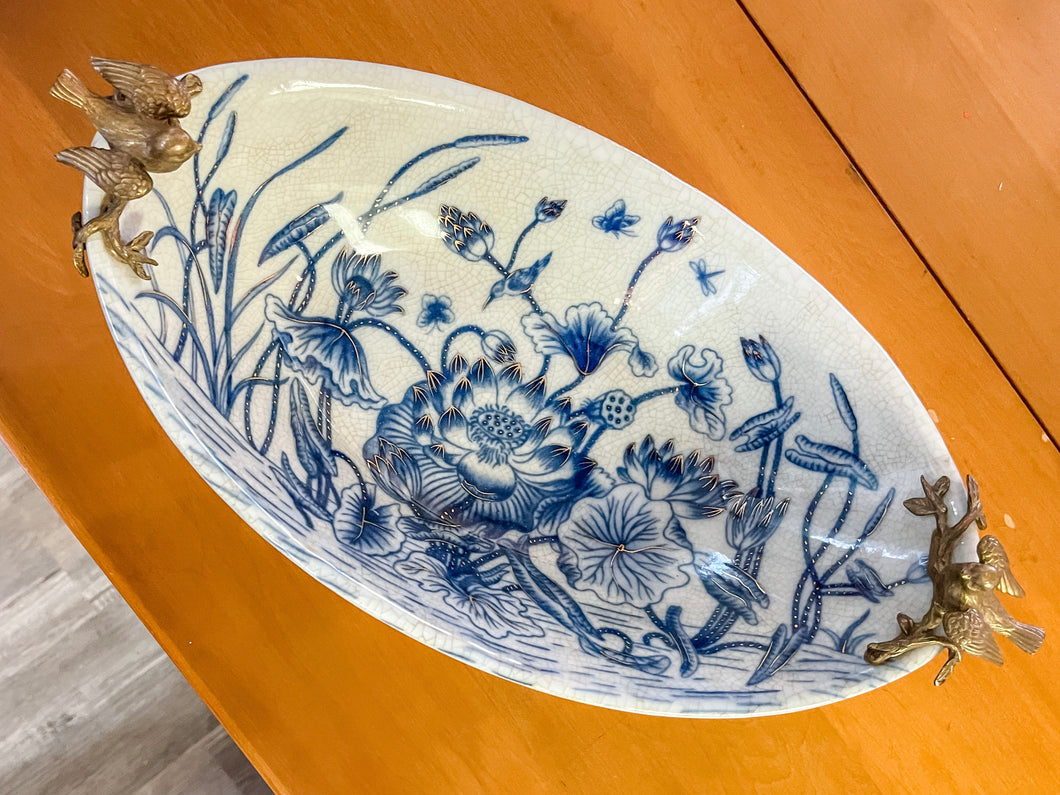 Large blue and white dish with brass birds