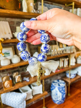 Load image into Gallery viewer, Blue and White blessing beads with Bronze/Gold Crucifix
