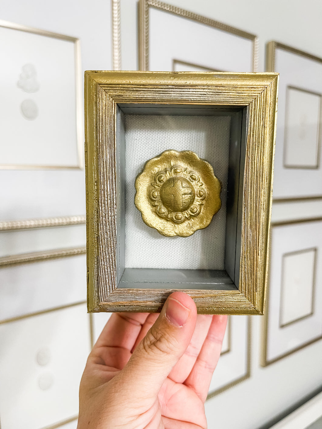 Shadow box with gold intaglio